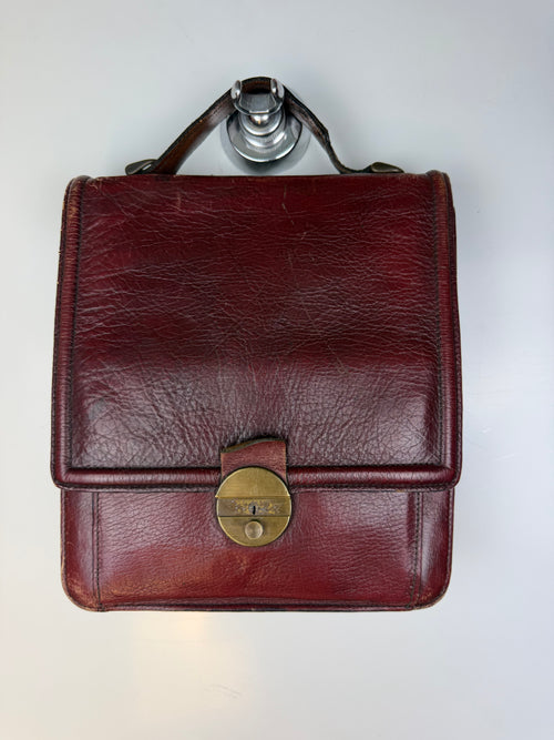 Borsa vintage in vera pelle bordeaux con chiusura in ottone