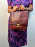 Borsa vintage in vera pelle bordeaux con chiusura in ottone